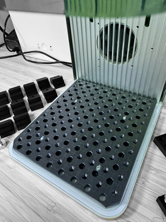 xTool F1 Jigmaker base with multiple holes for precise component placements and engravings.