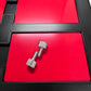 xTool F1 Ultra Business Card Jig with silver screws on red surface for precise engraving.