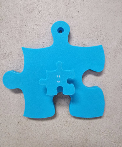 Kinderzimmer Wandhaken in Form eines Puzzle-Stücks aus umweltfreundlichem Material, ideal für die Aufbewahrung von Kinderaccessoires.