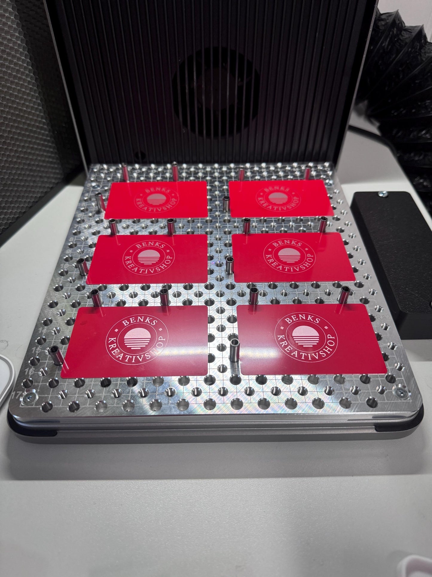 xTool F2 Ultra Jigmaker with red fixture plates for precision setups in laser applications.