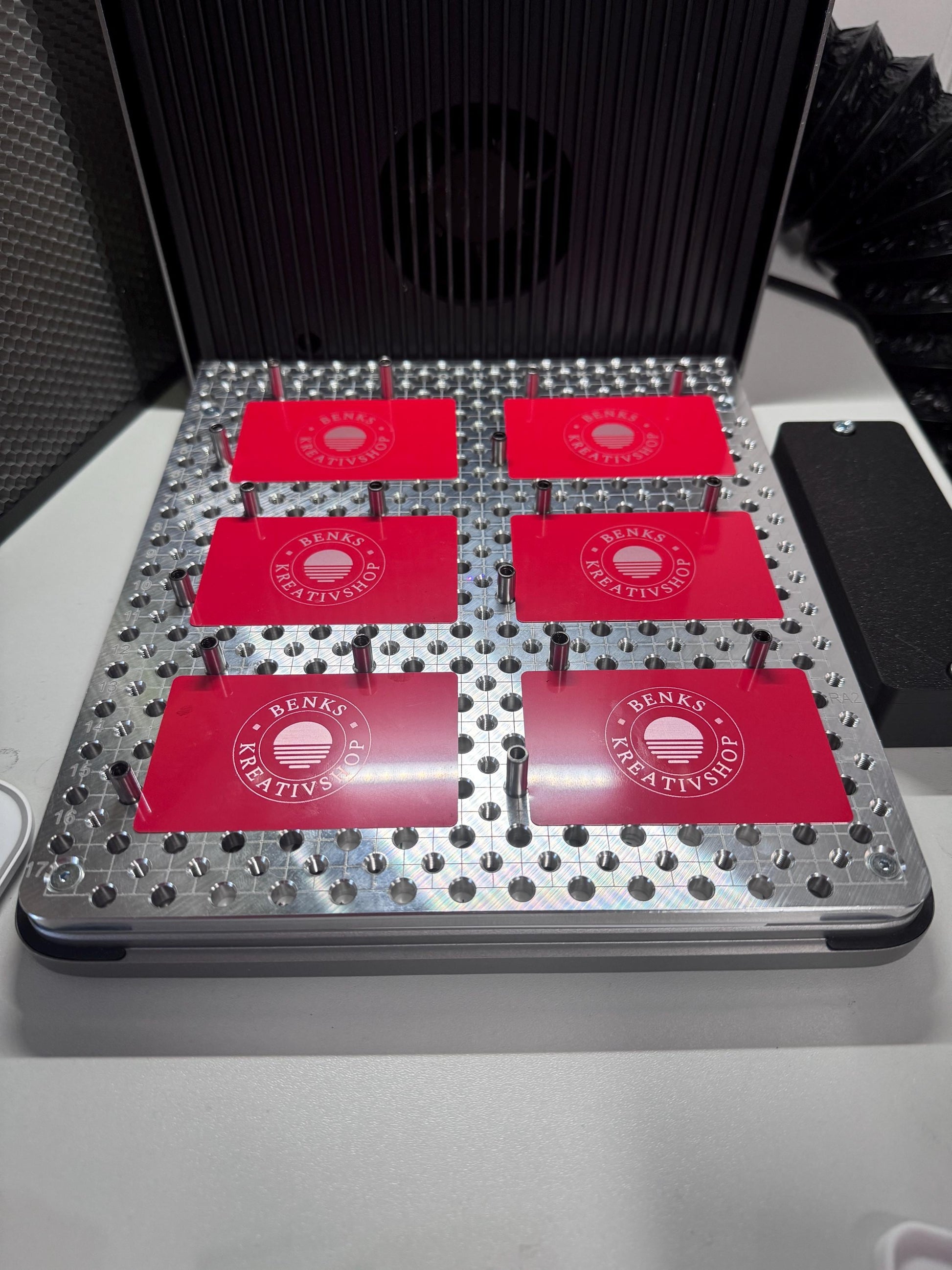xTool F2 Ultra Jigmaker with red fixture plates for precision setups in laser applications.
