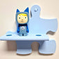 Tonie Wandregal Starterset mit einem blauen Puzzle-Regal und Tonie-Figur in Kinderzimmer-UI-Design.