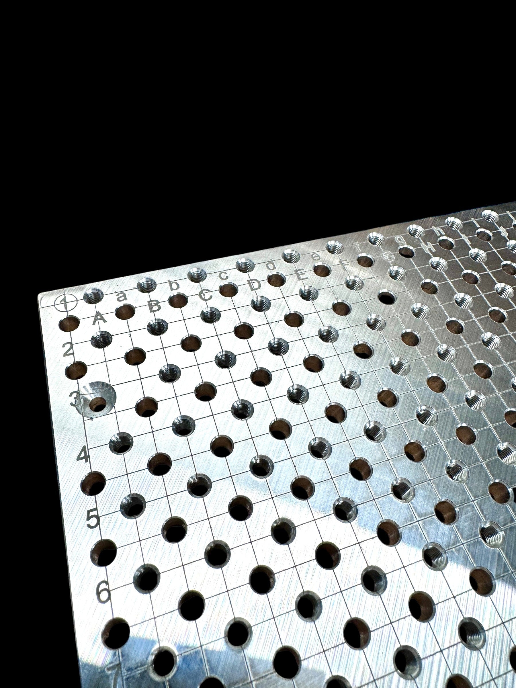 xTool F2 Ultra Jigmaker fixture plate showing a grid of holes for precision setups
