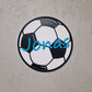 Personalisierbares Fußball-Türschild mit dem Namen Jonas auf einem Fußball-Design für das Kinderzimmer.