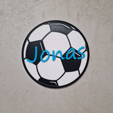 Personalisierbares Fußball-Türschild mit dem Namen Jonas auf einem Fußball-Design für das Kinderzimmer.